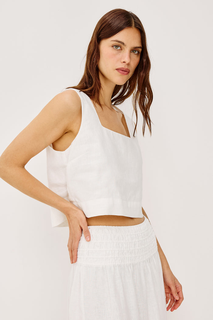 Akira Sleeveless Crop Top with Square Neckline and Wide Shoulder Straps in white Colorway - Front View Featured on Model