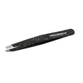 Anniversary Slant Tweezer | Tweezerman in black with a speckled design, featuring angled precision tips for effective eyebrow grooming and skincare routines.