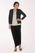 Woman wearing black full length pants