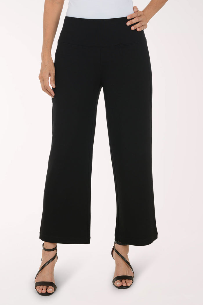 Woman wearing black full length pants
