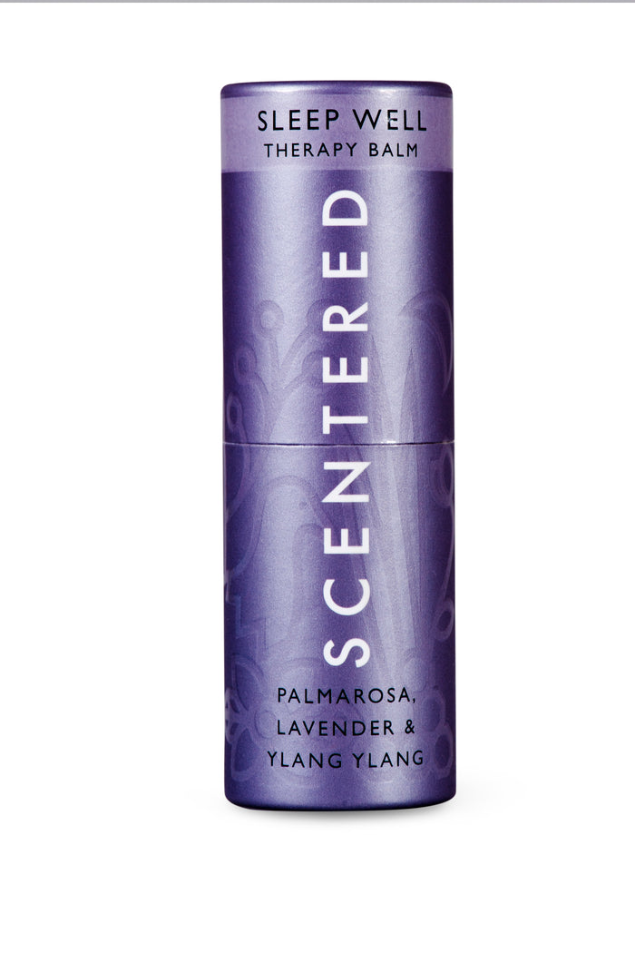 Sleep Well Therapy Balm | Scentered in a purple cylindrical container with calming palmarosa, lavender, and ylang ylang scents, designed for skincare and wellness.